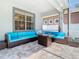 Screened in patio with comfortable seating and a modern table, ideal for relaxation at 9076 Lake Avon Dr, Orlando, FL 32829