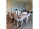Cozy dining room featuring a modern table set, a decorative wall, and comfortable seating at 987 Commons Way, Port Orange, FL 32129