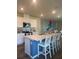 Modern kitchen with a center island, stainless steel appliances, and ample counter space at 987 Commons Way, Port Orange, FL 32129