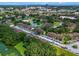 Aerial view of a community with multiple buildings, a lake, and a swimming pool at 11 Escondido Cir # 110, Altamonte Springs, FL 32701