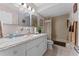 Bathroom with vanity and sink, plus a bathtub and shower behind a decorative curtain at 11 Escondido Cir # 110, Altamonte Springs, FL 32701
