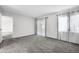 Spacious bedroom with neutral carpet, natural light, and access to outdoor space at 11 Escondido Cir # 110, Altamonte Springs, FL 32701