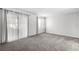 Bright bedroom features neutral carpet, natural light, and sliding glass door at 11 Escondido Cir # 110, Altamonte Springs, FL 32701