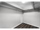 Walk-in closet with custom storage and modern flooring at 11 Escondido Cir # 110, Altamonte Springs, FL 32701