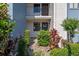 Charming entryway with a decorated door and lush landscaping at 11 Escondido Cir # 110, Altamonte Springs, FL 32701