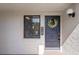 Inviting entryway with a decorated front door and a textured wall at 11 Escondido Cir # 110, Altamonte Springs, FL 32701