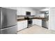 Bright kitchen features white cabinets and stainless steel appliances at 11 Escondido Cir # 110, Altamonte Springs, FL 32701