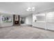 Living room with neutral carpet, a brick fireplace, a window and a built-in bar at 11 Escondido Cir # 110, Altamonte Springs, FL 32701