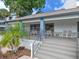 Outdoor patio area with table and chairs, palm trees, with a lovely view at 11 Escondido Cir # 110, Altamonte Springs, FL 32701