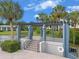 Scenic outdoor pergola area featuring stairs to water view, shade, landscaping and a life preserver at 11 Escondido Cir # 110, Altamonte Springs, FL 32701