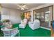 Bright and airy sun room featuring comfortable seating, a ceiling fan, and sliding glass doors at 11 Escondido Cir # 110, Altamonte Springs, FL 32701