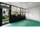 Sunroom with lots of windows that provide a view of landscaped yard at 11 Escondido Cir # 110, Altamonte Springs, FL 32701