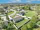 A high angle view of a well-maintained house with a spacious, green fenced-in backyard at 116 Alcala Dr, Kissimmee, FL 34758