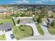 A bird's eye view of a home in a suburban neighborhood with a fenced in yard at 116 Alcala Dr, Kissimmee, FL 34758