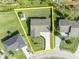 An aerial shot of a home showcasing the layout of the property and the surrounding neighborhood at 116 Alcala Dr, Kissimmee, FL 34758