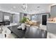 Open dining and kitchen area with modern lighting, seating, and ample counter space at 116 Alcala Dr, Kissimmee, FL 34758