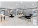 Bright and airy open-concept living space, featuring modern furnishings and marble flooring at 116 Alcala Dr, Kissimmee, FL 34758