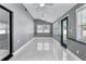 Bright sun room with ample natural light, tile flooring, and views of the outdoors at 116 Alcala Dr, Kissimmee, FL 34758
