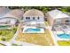 Aerial view of a home with an enclosed pool and backyard surrounded by a white fence at 1204 Blackheath Ct, Davenport, FL 33897