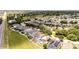 Community aerial view showcasing multiple homes with screened-in pools and lush green spaces at 1204 Blackheath Ct, Davenport, FL 33897