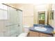 Cozy bathroom featuring a shower, vanity, and toilet at 1204 Blackheath Ct, Davenport, FL 33897