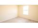 Cozy bedroom with neutral carpeting, bright natural light, and electrical outlets at 1204 Blackheath Ct, Davenport, FL 33897