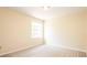 This bedroom has neutral carpet, light colored walls, and a window that provides natural light at 1204 Blackheath Ct, Davenport, FL 33897