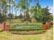 Welcoming entrance sign to Highlands Reserve Golf Community with manicured landscaping at 1204 Blackheath Ct, Davenport, FL 33897