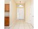 Bright foyer with a tiled floor, a pendant light fixture, and front door at 1204 Blackheath Ct, Davenport, FL 33897