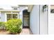 Close-up of front entrance, with an inviting doorway and tiled walkway at 1204 Blackheath Ct, Davenport, FL 33897