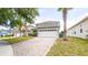 Street view of a well-maintained two-story home with a spacious driveway and lush landscaping at 1204 Blackheath Ct, Davenport, FL 33897