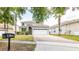 Charming two-story home featuring a brick driveway and well-maintained landscaping at 1204 Blackheath Ct, Davenport, FL 33897