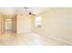 Bright, open living room with tile flooring, ceiling fan, and natural light at 1204 Blackheath Ct, Davenport, FL 33897
