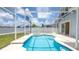 This screened-in pool area complete with a hot tub, and plenty of space for entertaining at 1204 Blackheath Ct, Davenport, FL 33897