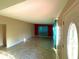 Spacious living room featuring neutral walls, and teal drapes for a bright and airy atmosphere at 1221 Oak Haven Dr, Altamonte Springs, FL 32714