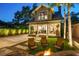 A cozy backyard setting features a brick fire pit and ample seating, perfect for outdoor entertaining and relaxation at 13 Hill Ave, Orlando, FL 32801
