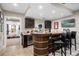 Finished basement bar featuring granite countertops, a beverage cooler, and ample cabinet space at 13 Hill Ave, Orlando, FL 32801