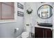 Modern powder room with marble tile wall and unique vessel sink at 13 Hill Ave, Orlando, FL 32801