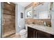A stylish bathroom offers a tiled shower, granite countertop vanity, and neutral tones for a calming spa experience at 13 Hill Ave, Orlando, FL 32801