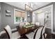 Elegant dining room with modern lighting, large window, and stylish table decor at 13 Hill Ave, Orlando, FL 32801