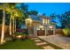 Two-story building with a two-car garage and an outdoor patio area at 13 Hill Ave, Orlando, FL 32801