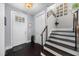 Bright foyer with hardwood floors, staircase, and a decorative accent wall at 13 Hill Ave, Orlando, FL 32801