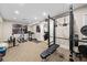Home gym with a variety of equipment including weights, rowing machine, and ample space for workouts at 13 Hill Ave, Orlando, FL 32801