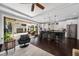 Open kitchen with dark island, stainless appliances, and sliding doors leading to outdoor patio at 13 Hill Ave, Orlando, FL 32801