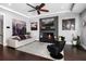 Cozy living room with modern fireplace, TV, stylish decor, and comfortable seating at 13 Hill Ave, Orlando, FL 32801