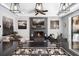 Open-concept view from kitchen to living room featuring modern fireplace and stylish decor at 13 Hill Ave, Orlando, FL 32801