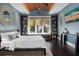 Comfortable main bedroom with wood ceiling, built-in shelves, and window seat at 13 Hill Ave, Orlando, FL 32801