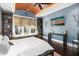 Inviting main bedroom with wood ceiling, built-in shelves, and window seat at 13 Hill Ave, Orlando, FL 32801