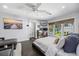Bright main bedroom with hardwood floors, a work space, and a ceiling fan at 13 Hill Ave, Orlando, FL 32801