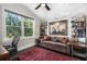 Bright home office featuring a large window, hardwood floors, and built-in shelving at 13 Hill Ave, Orlando, FL 32801